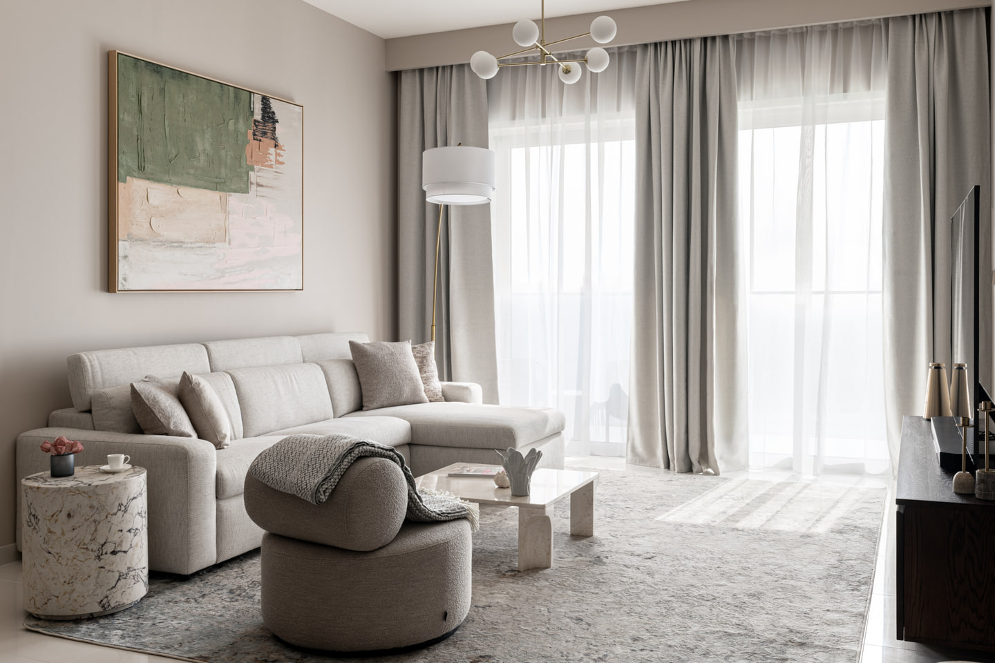 Dubai apartment living room with pale upholstery and sculptural furniture